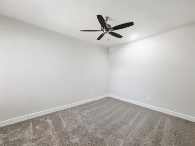 a view of a balcony with a table and chairs