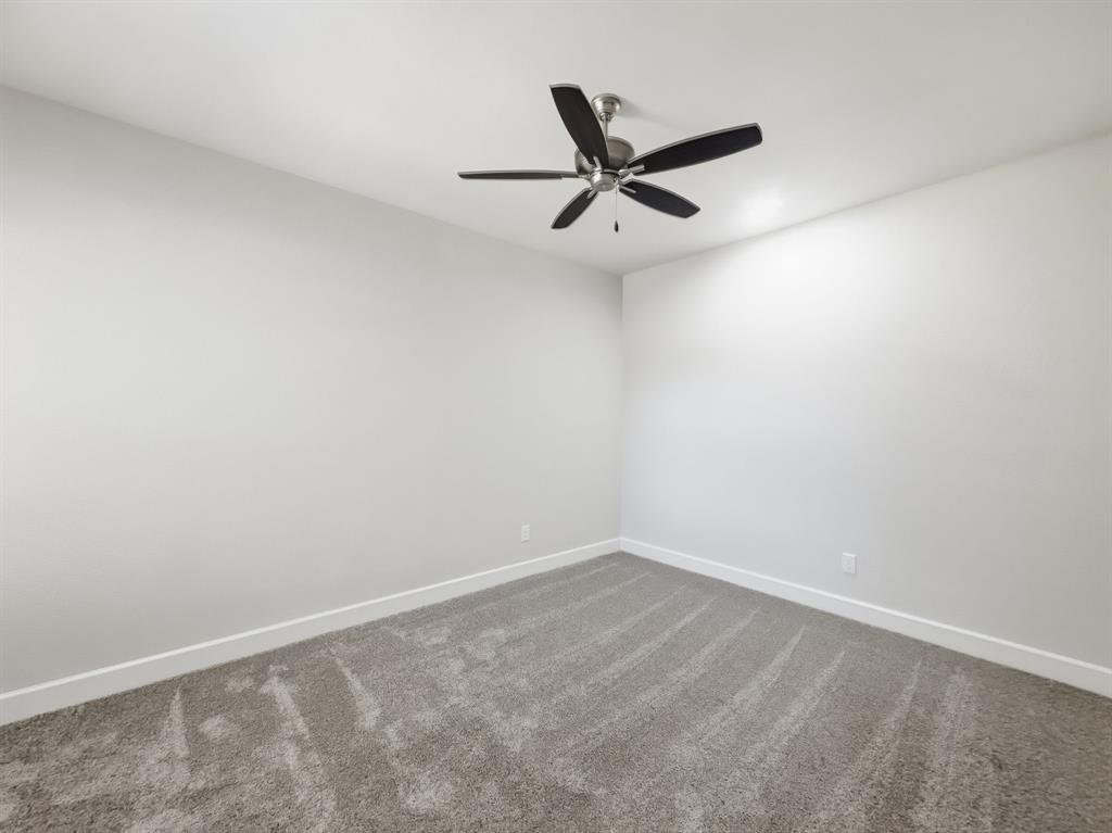 5704 Woodlands Drive The Colony, TX 75056 - Photo 10 of 23 a view of a big room with a fan