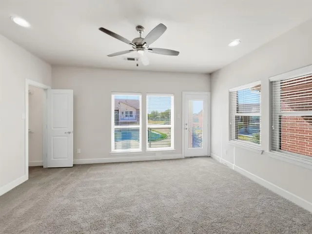 a view of a big room with a fan