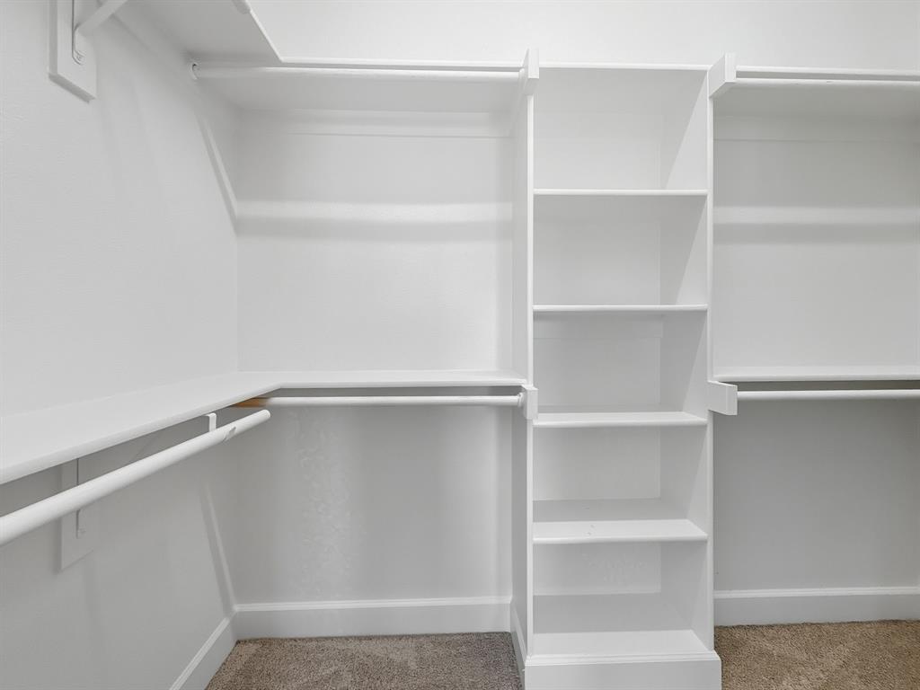 5704 Woodlands Drive The Colony, TX 75056 - Photo 18 of 23 a an empty walk in closet