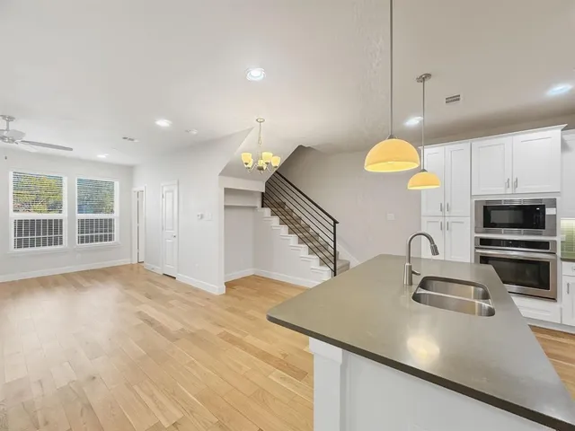 a bathroom with a bathtub sink and mirror