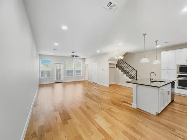 a view of a backyard with wooden fence