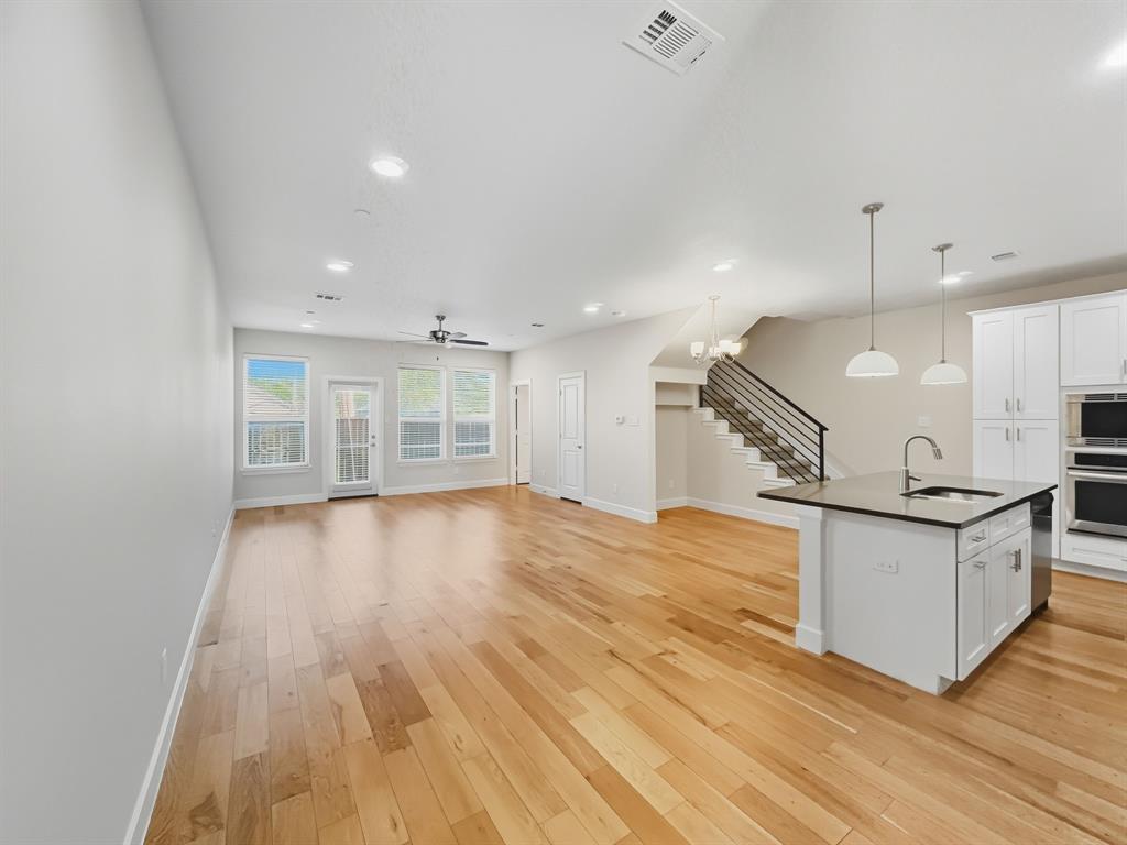 5704 Woodlands Drive The Colony, TX 75056 - Photo 23 of 23 a view of a kitchen with a sink and a stove