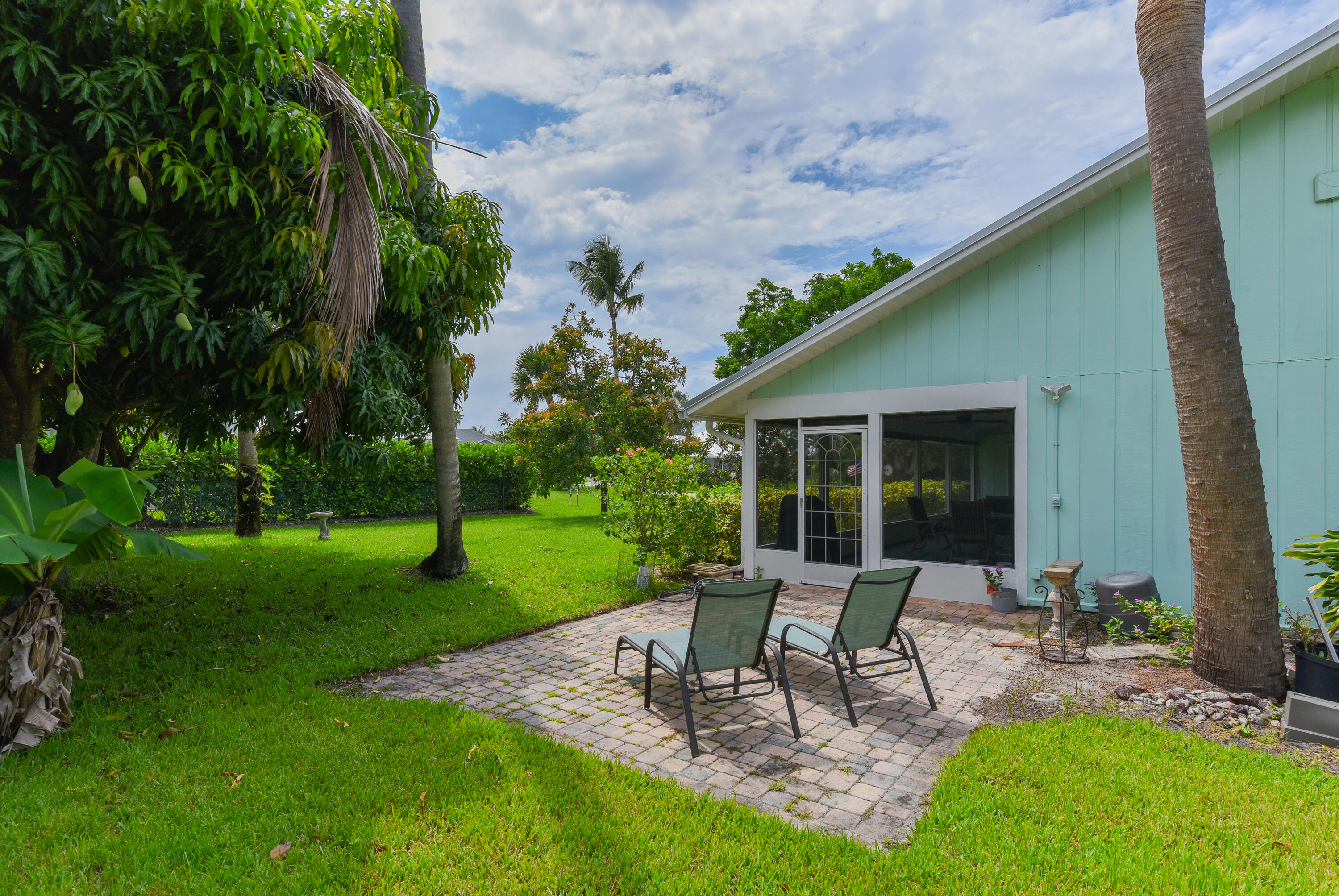 4240 Southeast Happy Lane Stuart, FL 34997 - Photo 26 of 39 Pavers Extend From Patio