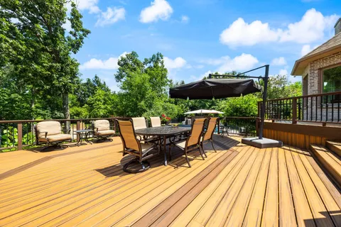 a view of a backyard with sitting area
