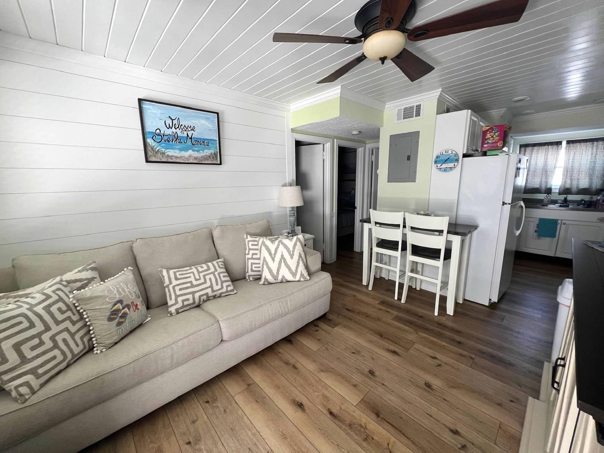 310 East Hand, Unit 4 Wildwood, NJ 08260 - Photo 3 of 17 a living room with furniture and wooden floor