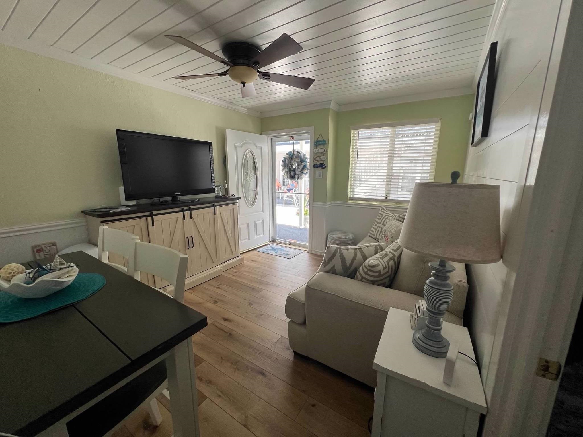 310 East Hand, Unit 4 Wildwood, NJ 08260 - Photo 5 of 17 a living room with furniture and a flat screen tv