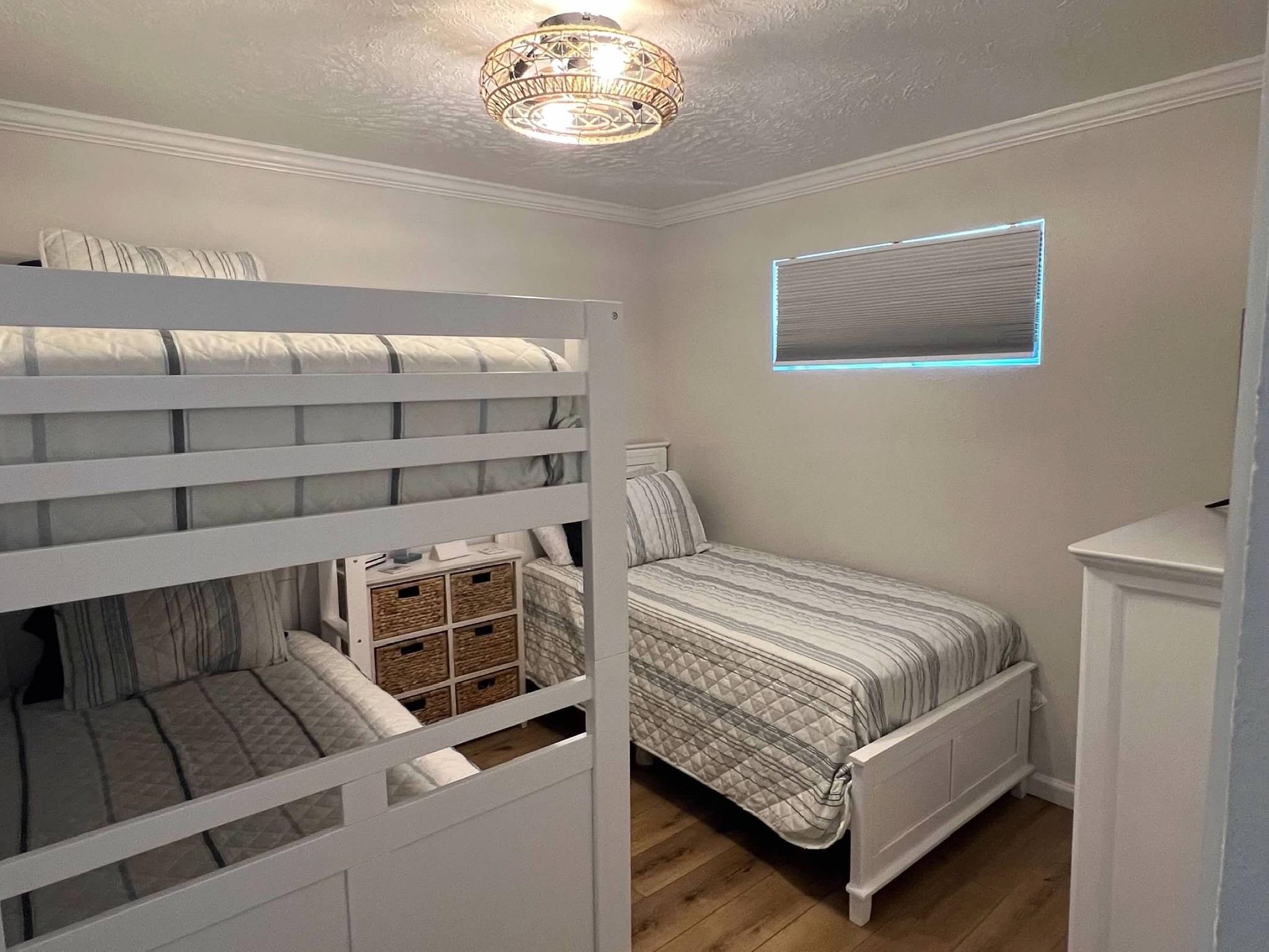 310 East Hand, Unit 4 Wildwood, NJ 08260 - Photo 9 of 17 a bedroom with a bed and a window