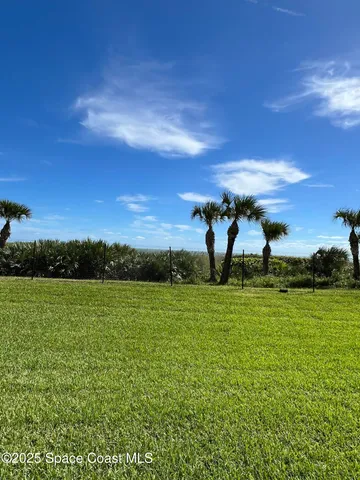 a view of outdoor space with deck and yard