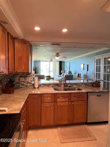 a kitchen with lots of counter top space and sink