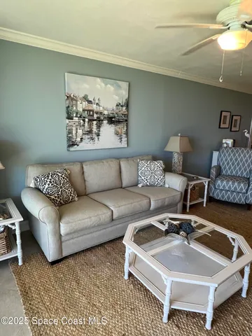 a living room with furniture and a rug