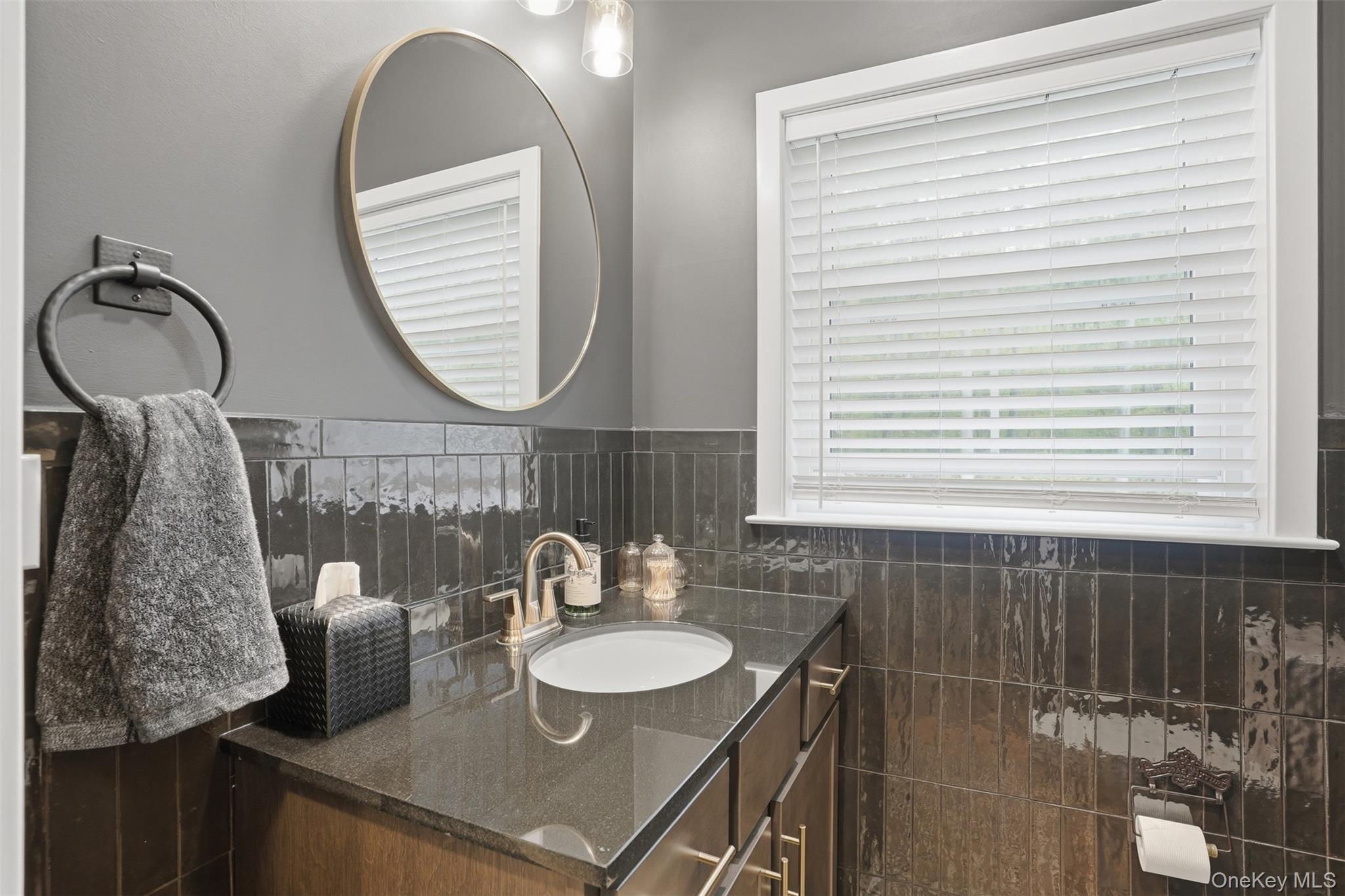9 Schoolhouse Road Middletown, NY 10940 - Photo 13 of 36 a bathroom with a sink and a mirror