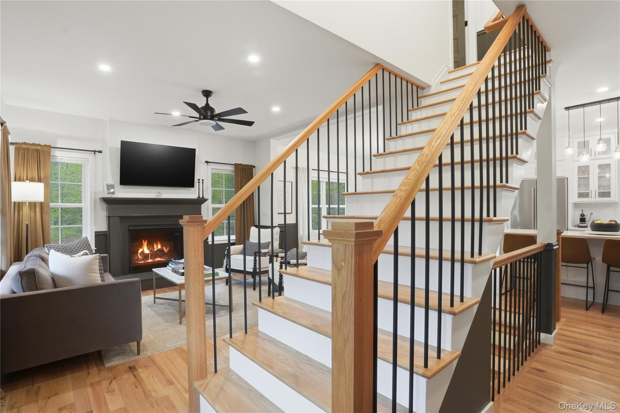 9 Schoolhouse Road Middletown, NY 10940 - Photo 15 of 36 a living room with wooden floor and a fireplace