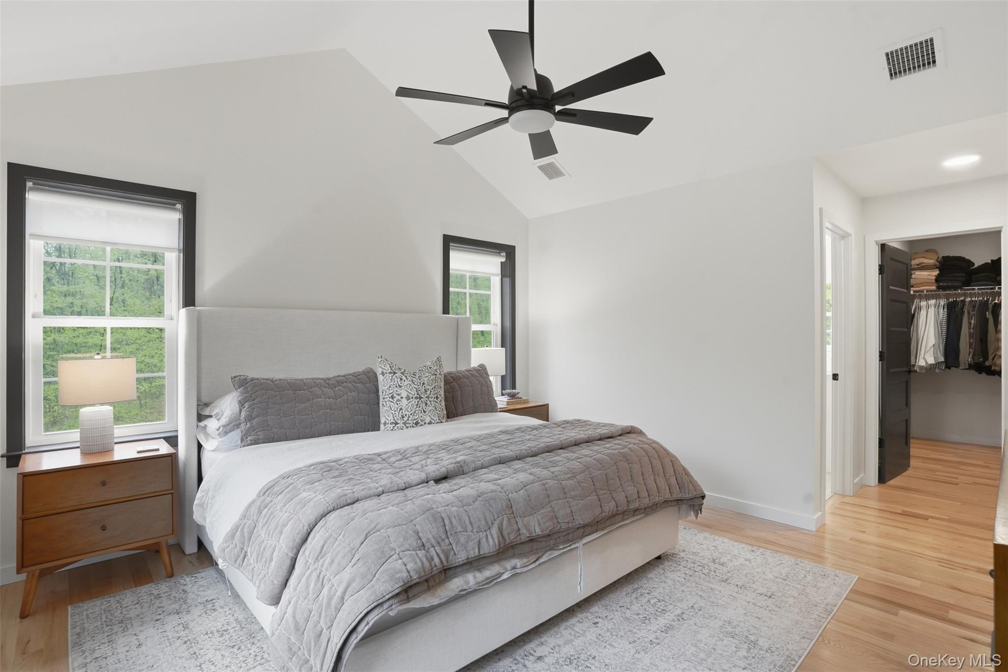 9 Schoolhouse Road Middletown, NY 10940 - Photo 17 of 36 a bedroom with a large bed a chandelier and a window