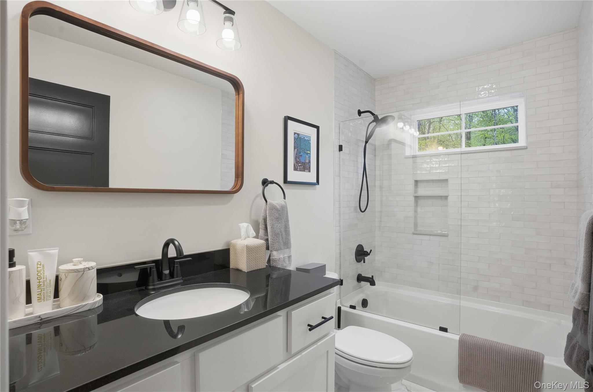 9 Schoolhouse Road Middletown, NY 10940 - Photo 22 of 36 a bathroom with a granite countertop sink toilet and shower