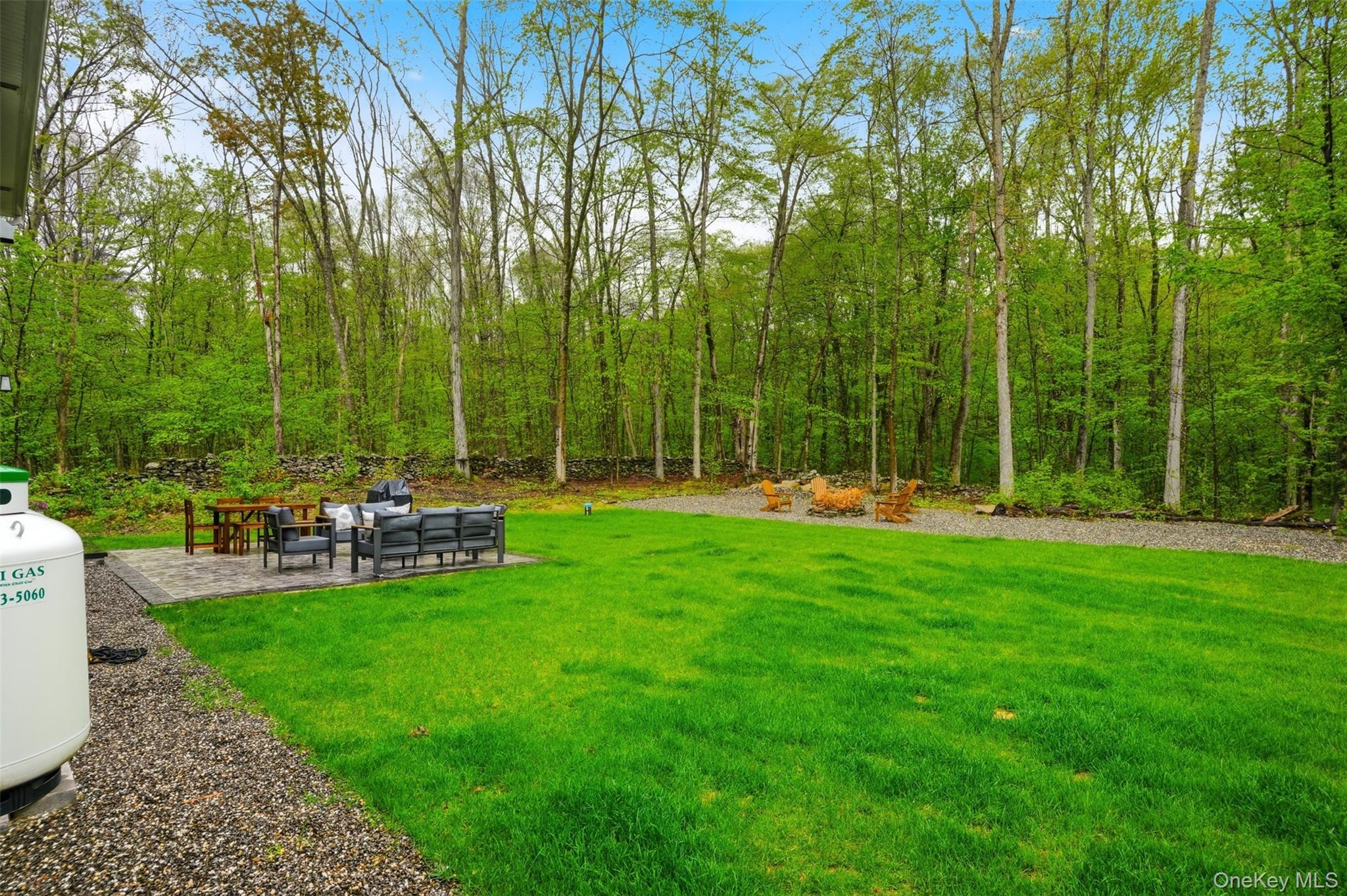 9 Schoolhouse Road Middletown, NY 10940 - Photo 31 of 36 a view of a chair and table in the garden