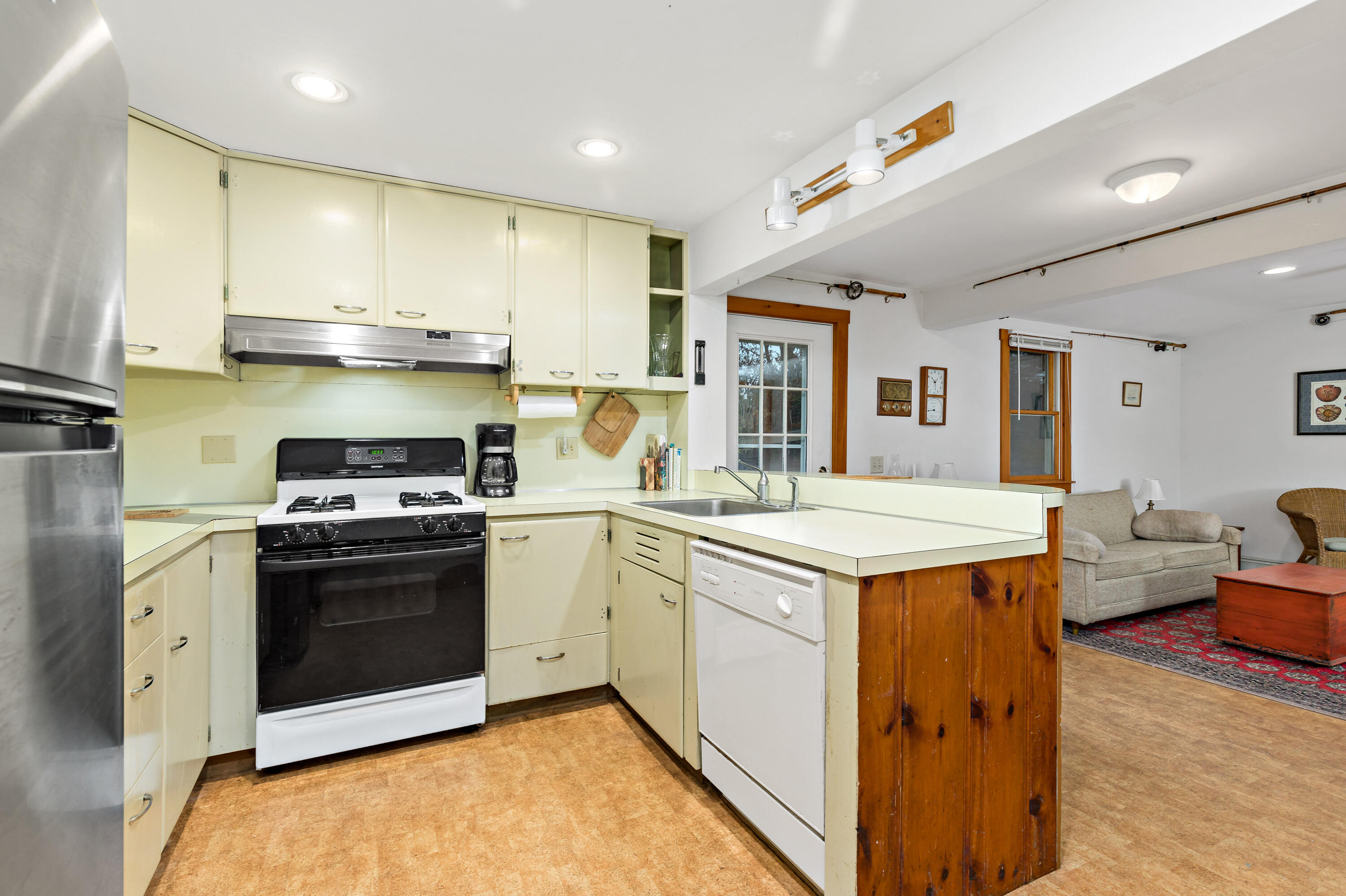 520 Samoset Road Eastham, MA 02642 - Photo 12 of 46 a kitchen with stainless steel appliances granite countertop a stove and a sink