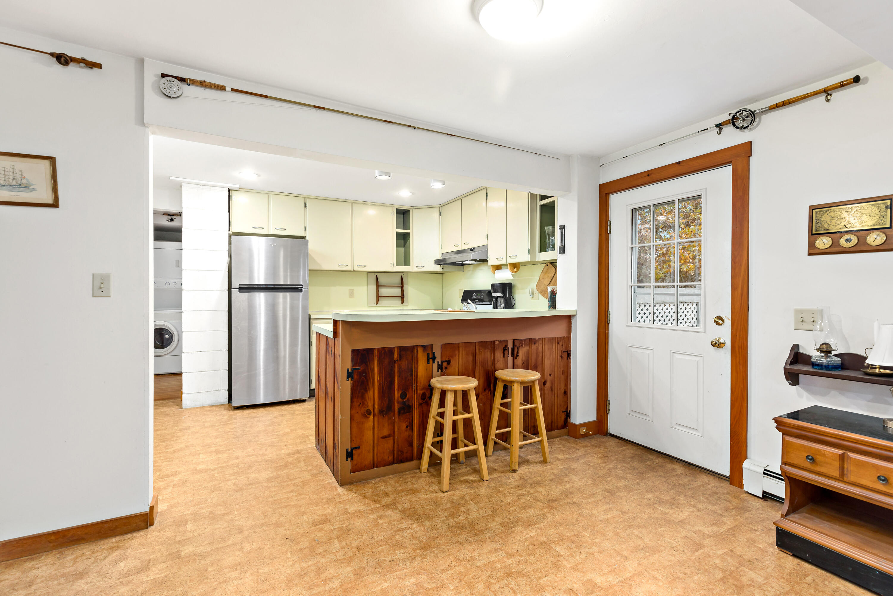 520 Samoset Road Eastham, MA 02642 - Photo 13 of 46 a kitchen with stainless steel appliances kitchen island granite countertop a refrigerator and a stove top oven