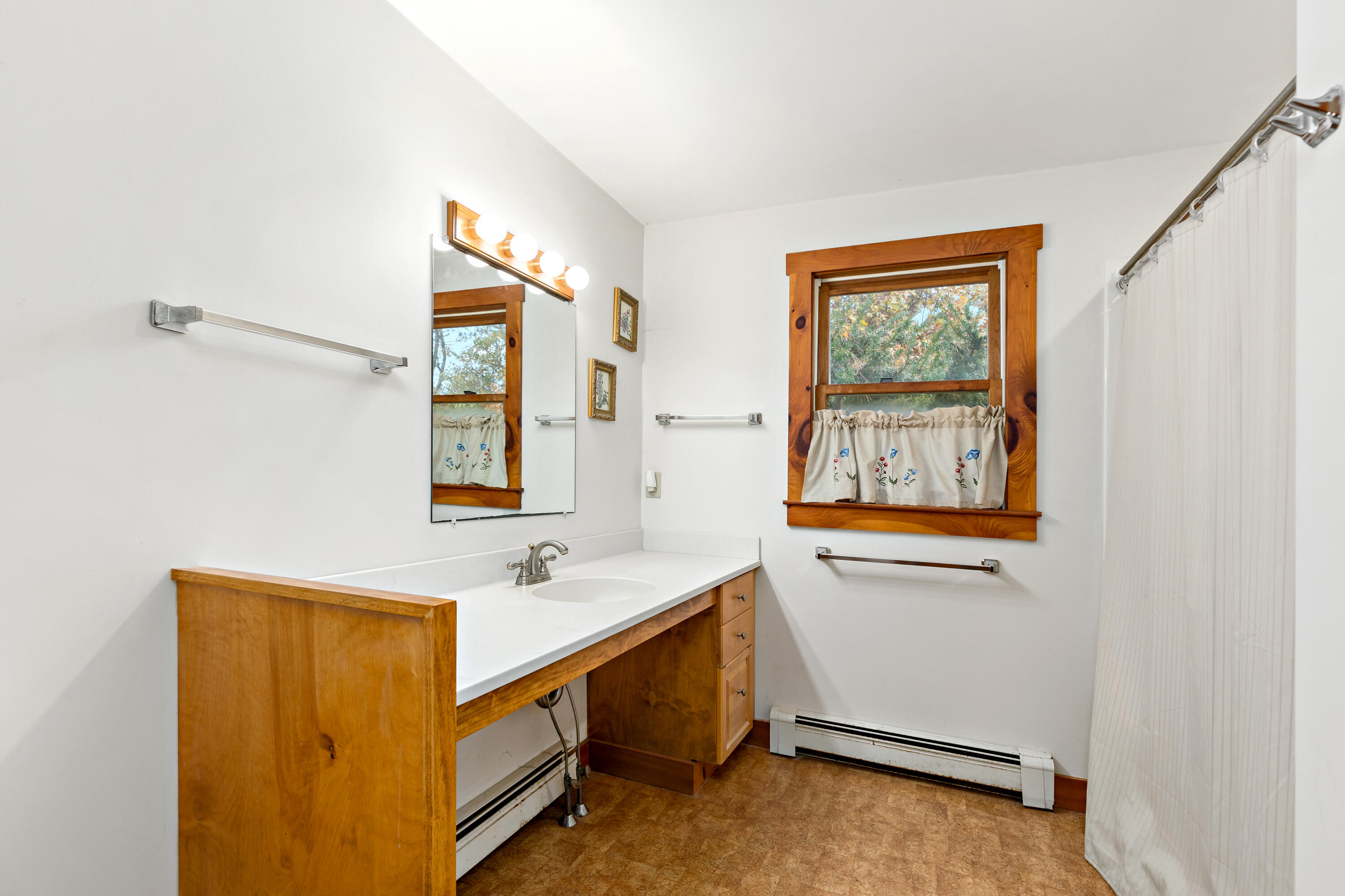 520 Samoset Road Eastham, MA 02642 - Photo 22 of 46 a bathroom with a sink a mirror and a window