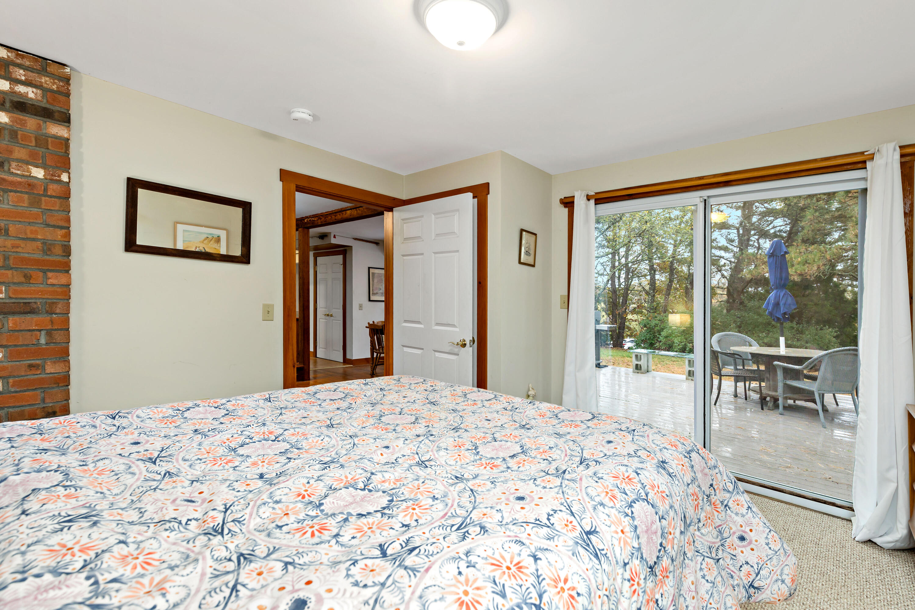 520 Samoset Road Eastham, MA 02642 - Photo 23 of 46 a bedroom with a large bed and a large window