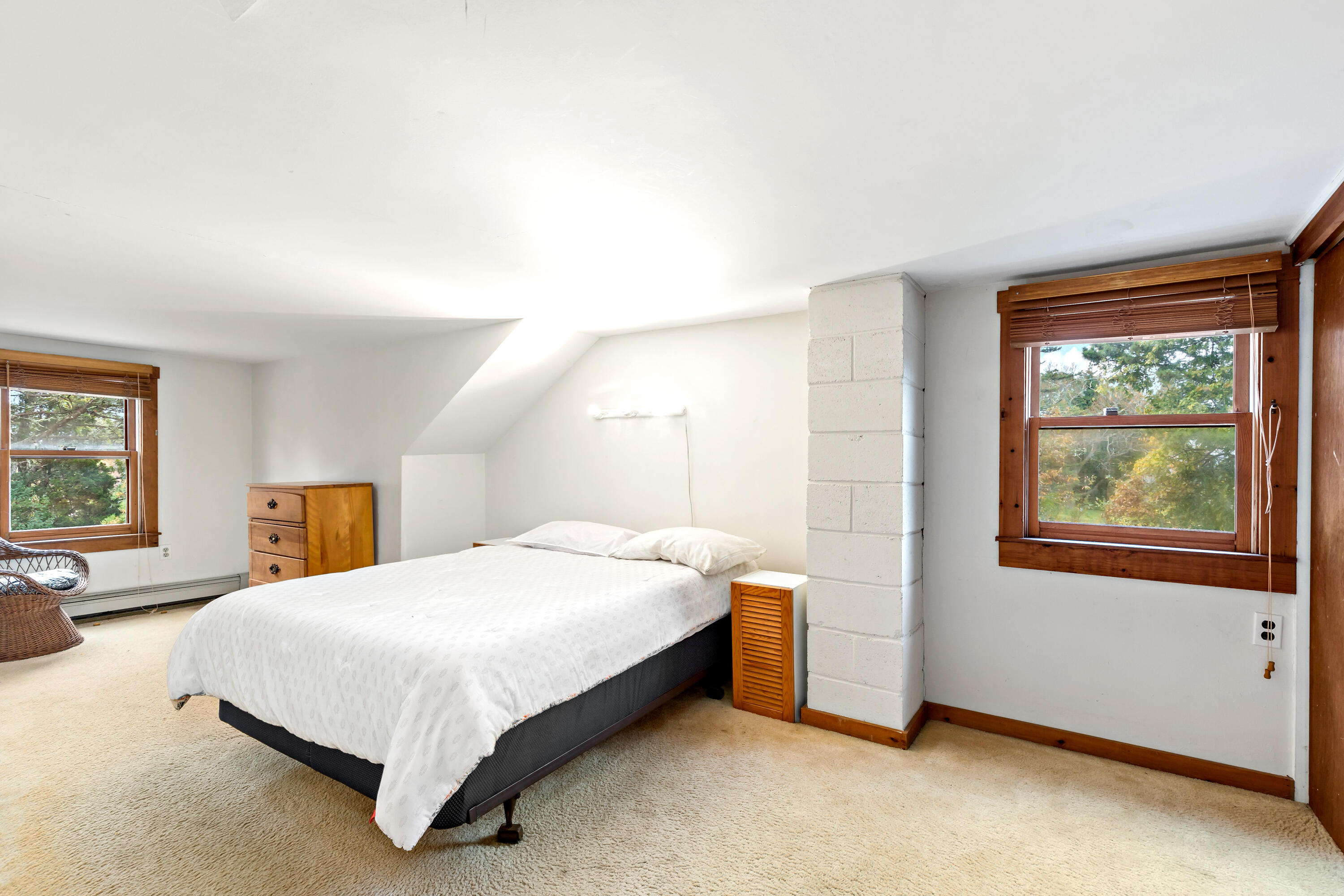 520 Samoset Road Eastham, MA 02642 - Photo 26 of 46 a bedroom with a bed lamp and a window