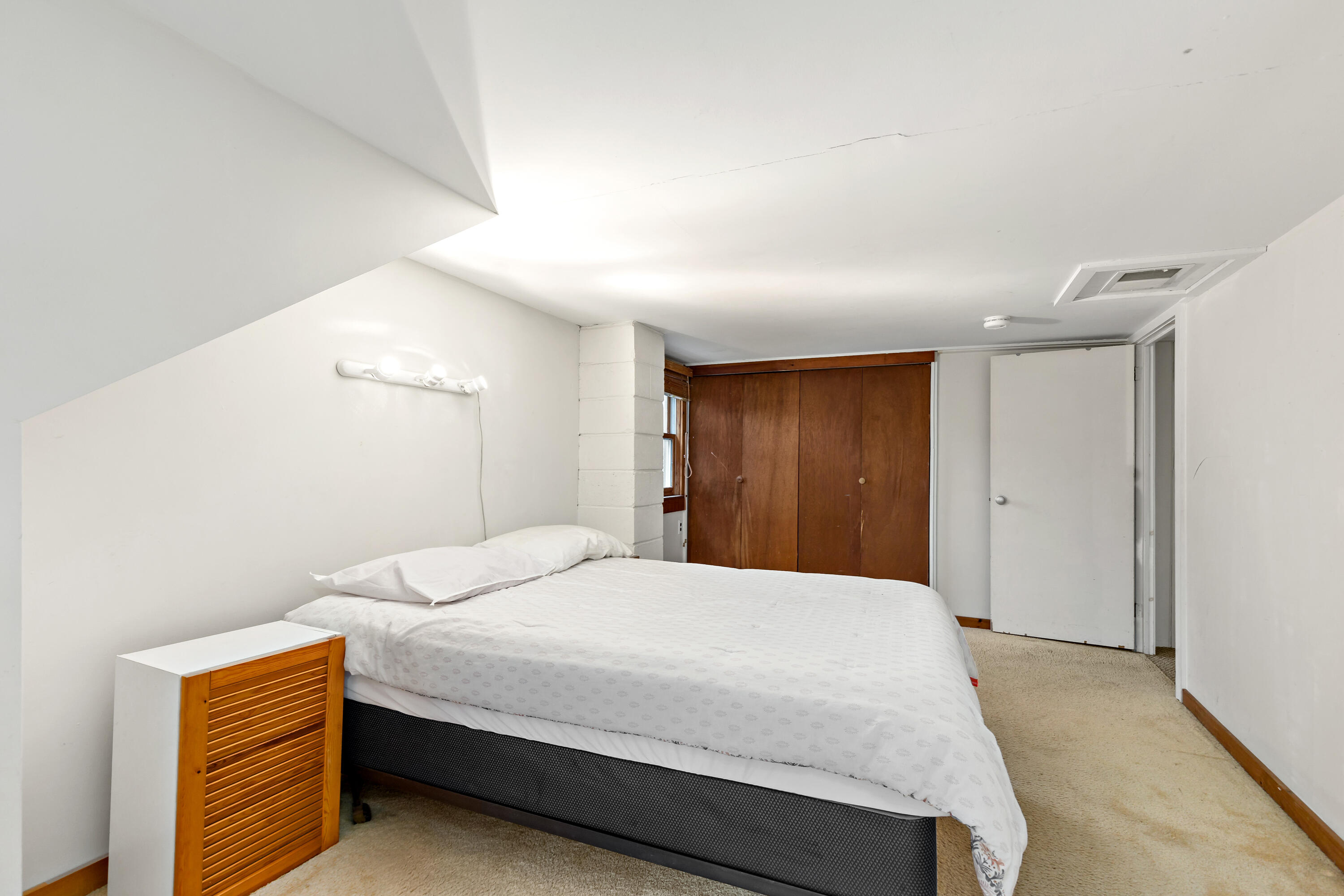 520 Samoset Road Eastham, MA 02642 - Photo 27 of 46 a bedroom with a bed and a closet