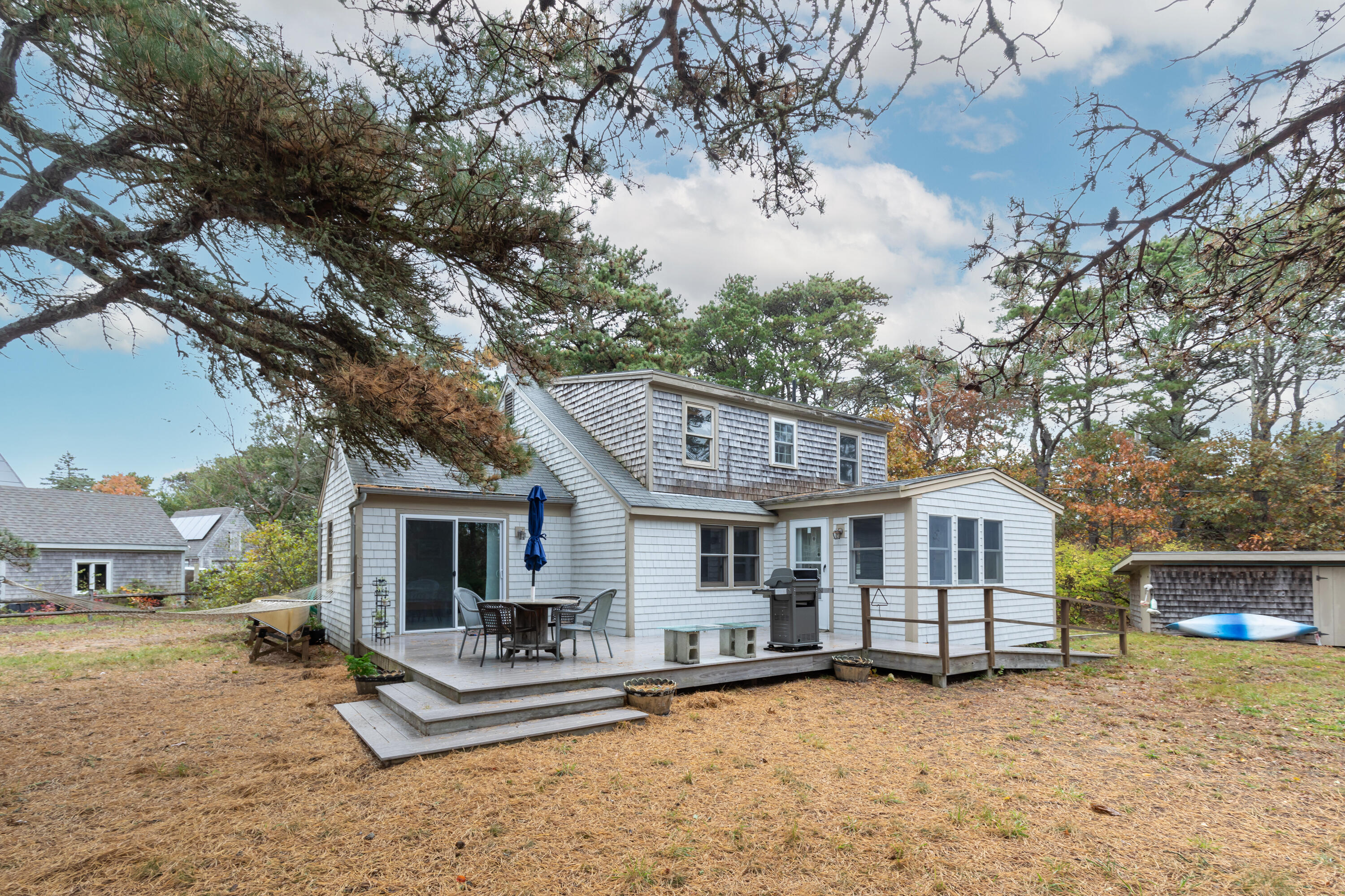 520 Samoset Road Eastham, MA 02642 - Photo 7 of 46 a white house that has a tree in front of it