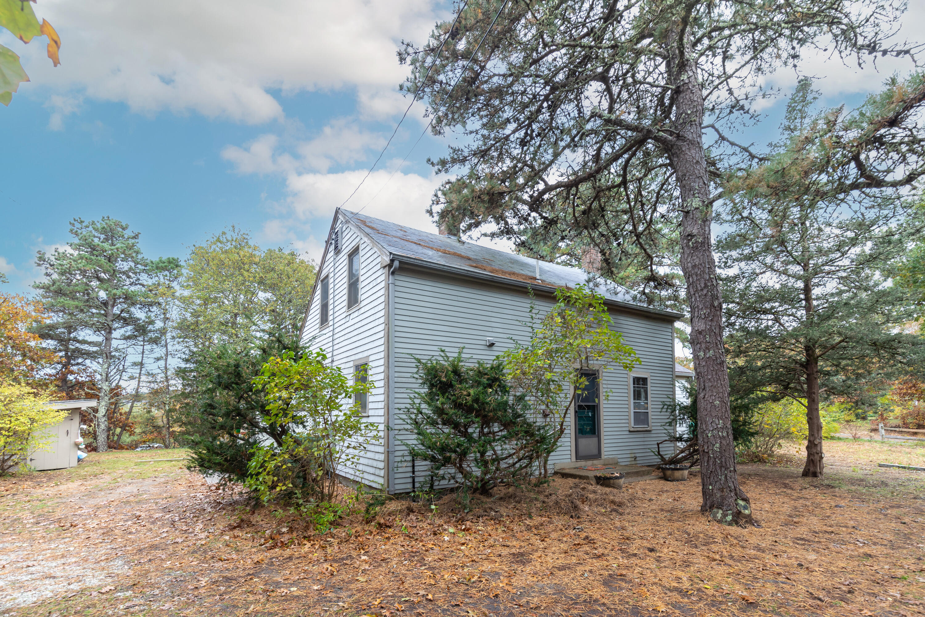 520 Samoset Road Eastham, MA 02642 - Photo 8 of 46 a view of a house with a tree in the background