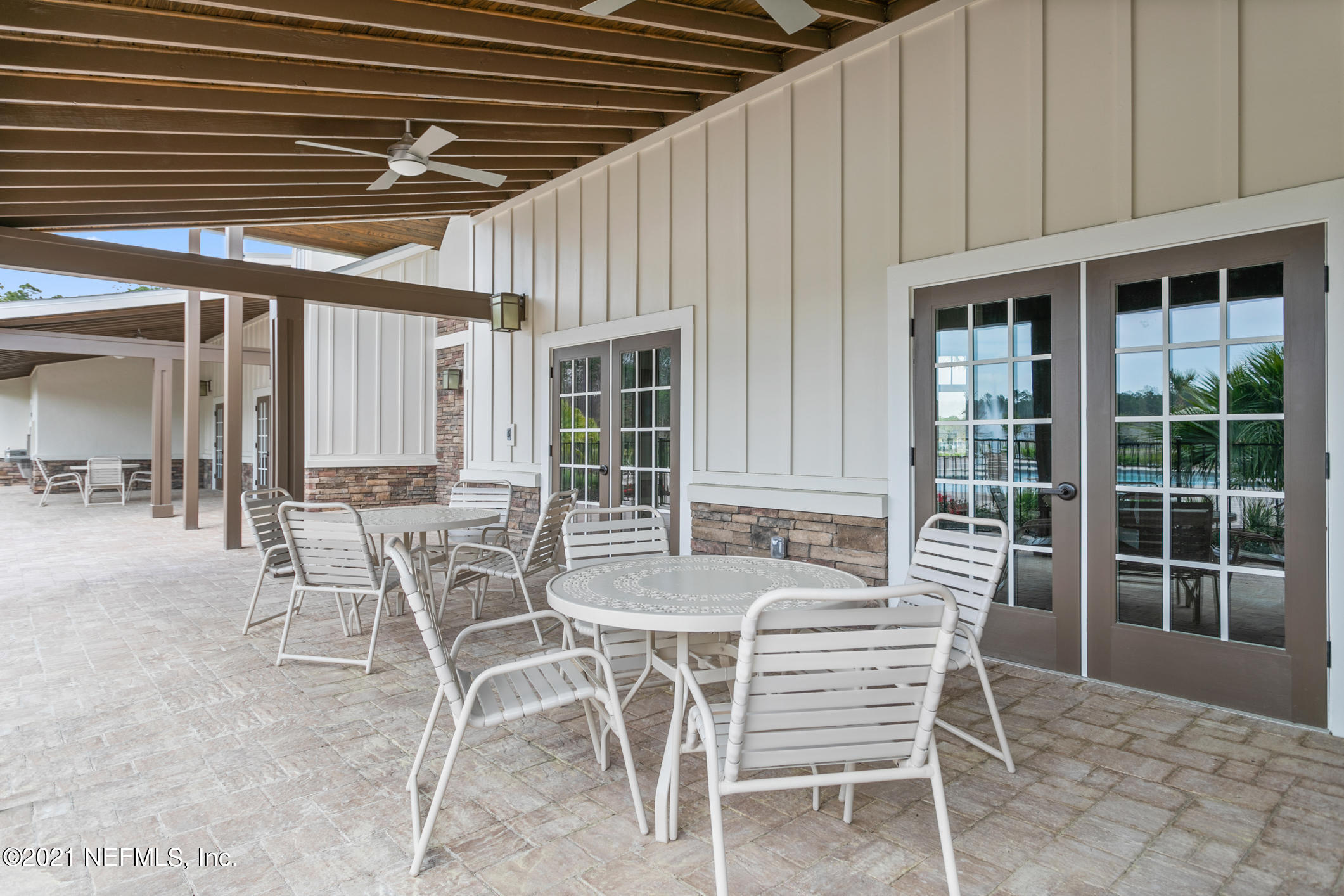 142 Dove Tree Ln Street St. Augustine, FL 32095 - Photo 26 of 47 a patio with a table and chairs
