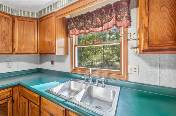 a view of a house with backyard and wooden floor