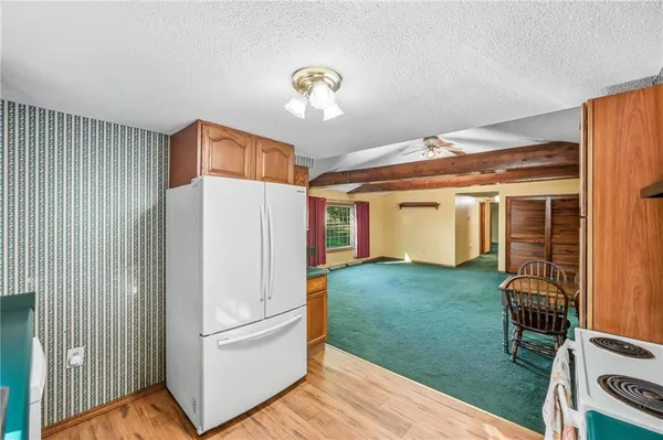 a big room with closet and a large window