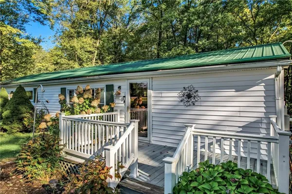 a view of a house with a tree