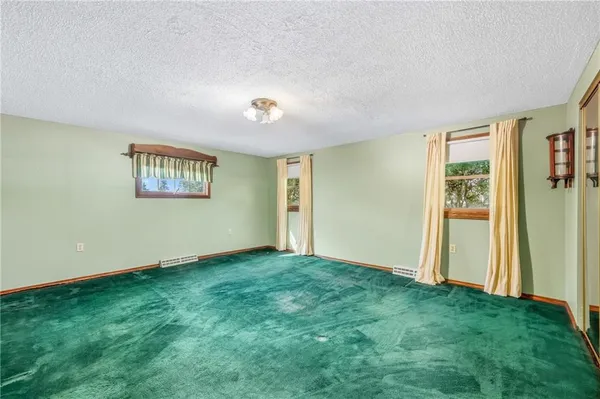 a bathroom with a shower and a toilet