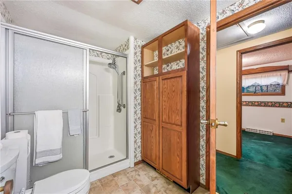 a bathroom with a sink mirror and a bathtub
