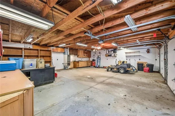 a roof deck with table and chairs