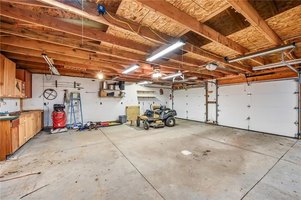 a kitchen with stainless steel appliances granite countertop a sink and cabinets
