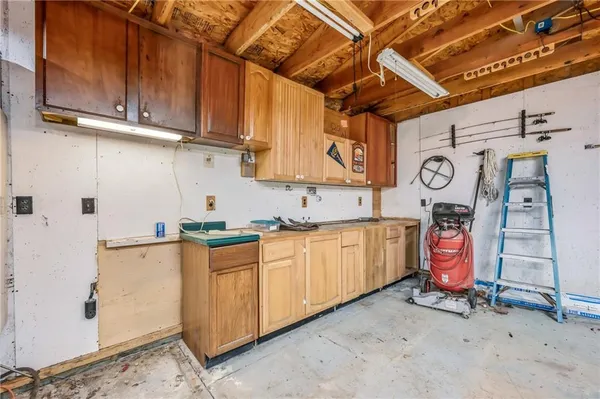 a kitchen with a refrigerator and window