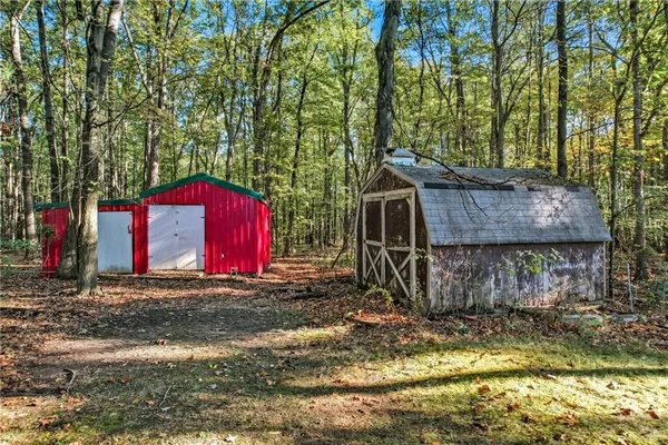 a view of a yard with an outdoor seating
