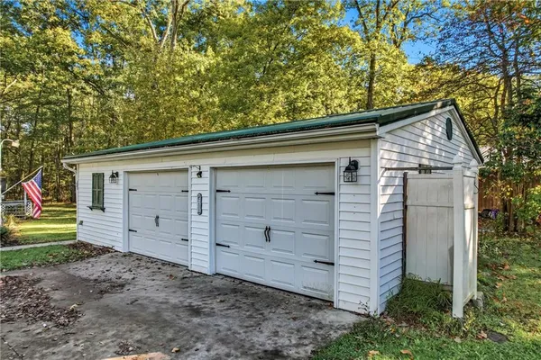 a view of a house with a backyard