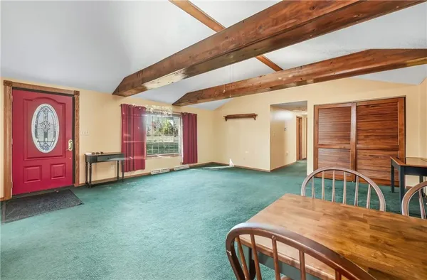 a bedroom with furniture and a window