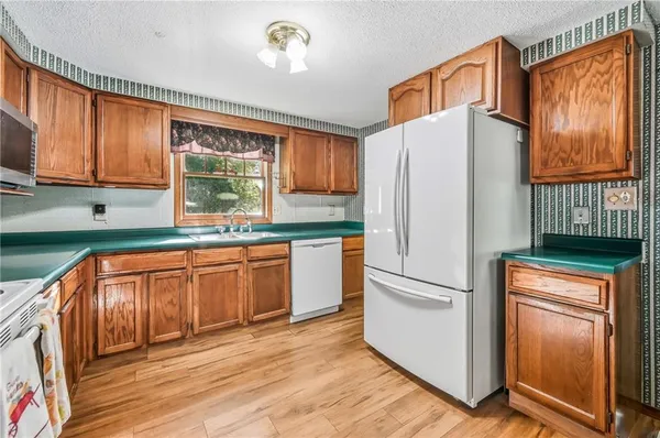 a kitchen with a sink and a large window