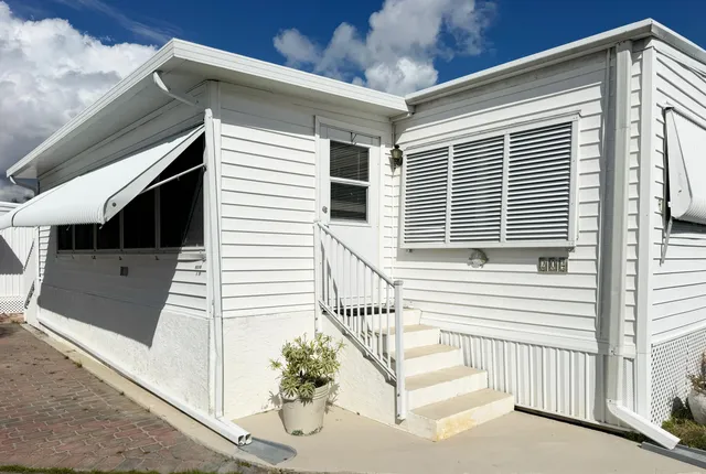 a view of a balcony with furniture