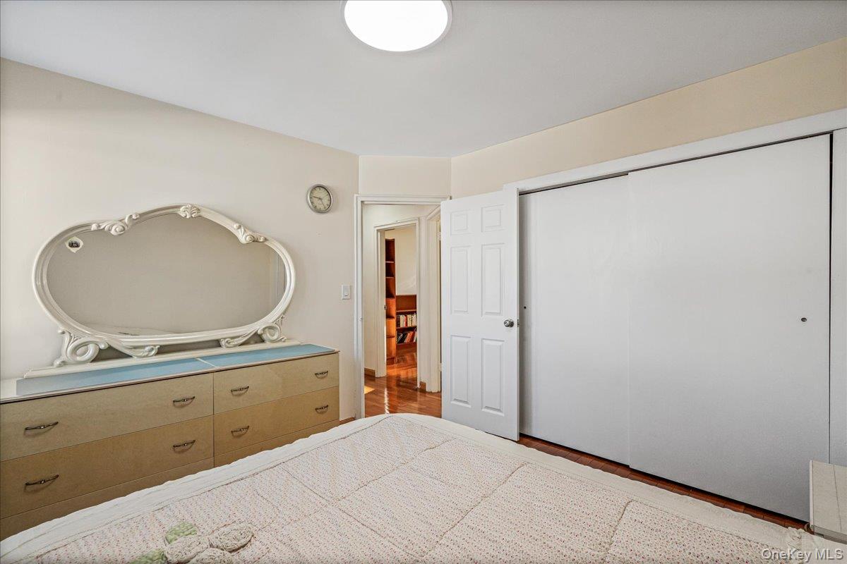 218-07 73rd Avenue, Unit UPPR Queens, NY 11364 - Photo 12 of 23 a bathroom with a granite countertop sink a mirror and a shower