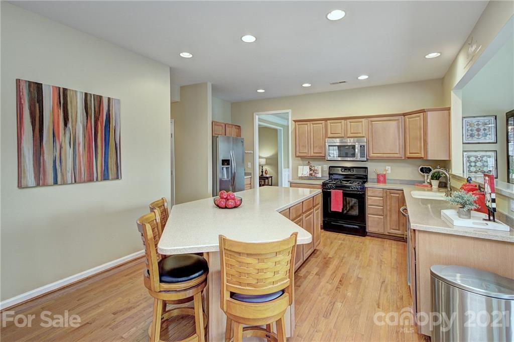 7025 Meyer Road Fort Mill, SC 29715 - Photo 11 of 41 a kitchen with refrigerator and cabinets