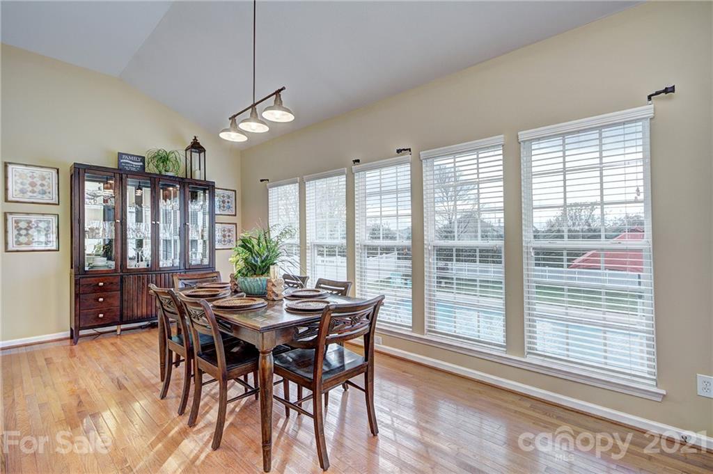 7025 Meyer Road Fort Mill, SC 29715 - Photo 14 of 41 a view of a dining room with furniture window and wooden floor
