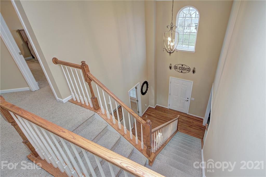 7025 Meyer Road Fort Mill, SC 29715 - Photo 19 of 41 a view of staircase with wooden floor and fan