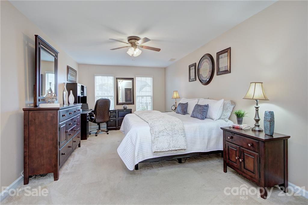 7025 Meyer Road Fort Mill, SC 29715 - Photo 20 of 41 a bedroom with bed and wooden floor