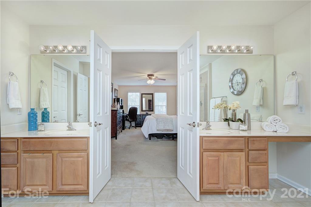 7025 Meyer Road Fort Mill, SC 29715 - Photo 21 of 41 a en suite bathroom with double sink and a mirror