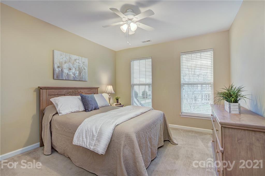 7025 Meyer Road Fort Mill, SC 29715 - Photo 26 of 41 a bedroom with a large bed and a window