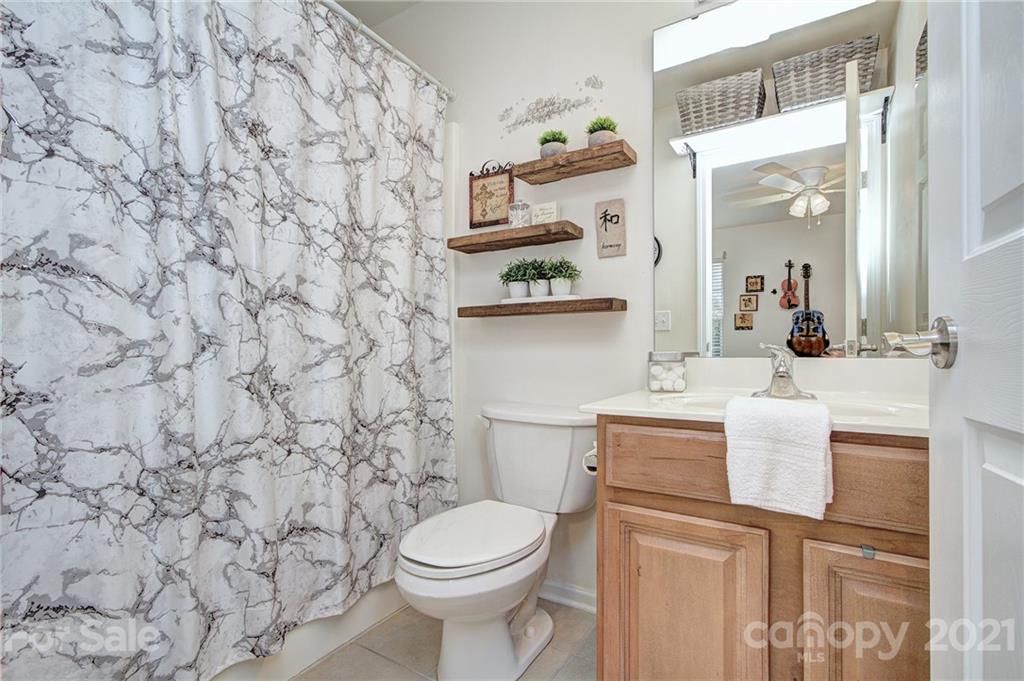 7025 Meyer Road Fort Mill, SC 29715 - Photo 28 of 41 a bathroom with a sink and a toilet